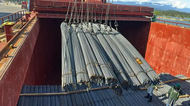 Rebar bundles lifted out of a cargo hold