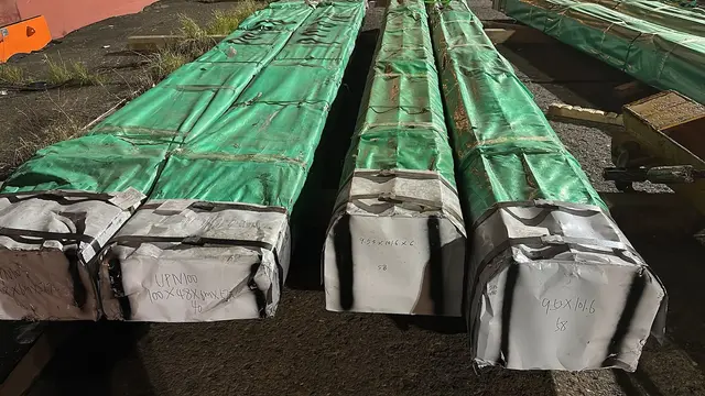 Steel bundles wrapped in green covers